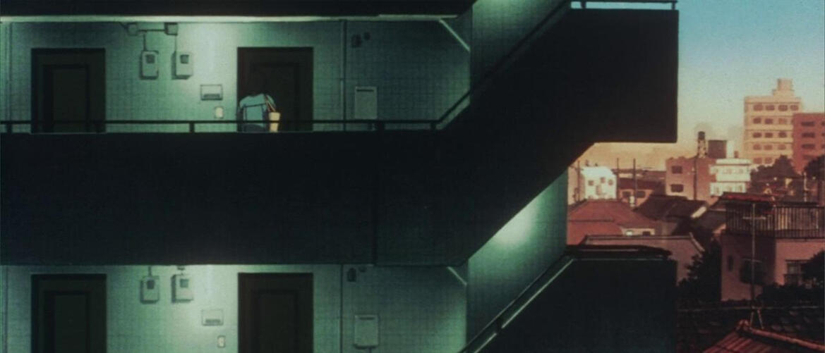 Drawn picture. A dark teal apartment building contrasts the pink and orange city. A character enters her apartment near the top.